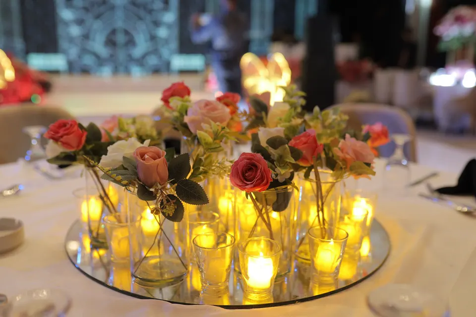 Flowers and candlelight arranged for a wedding celebration